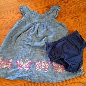 Denim dress with butterfly detail.